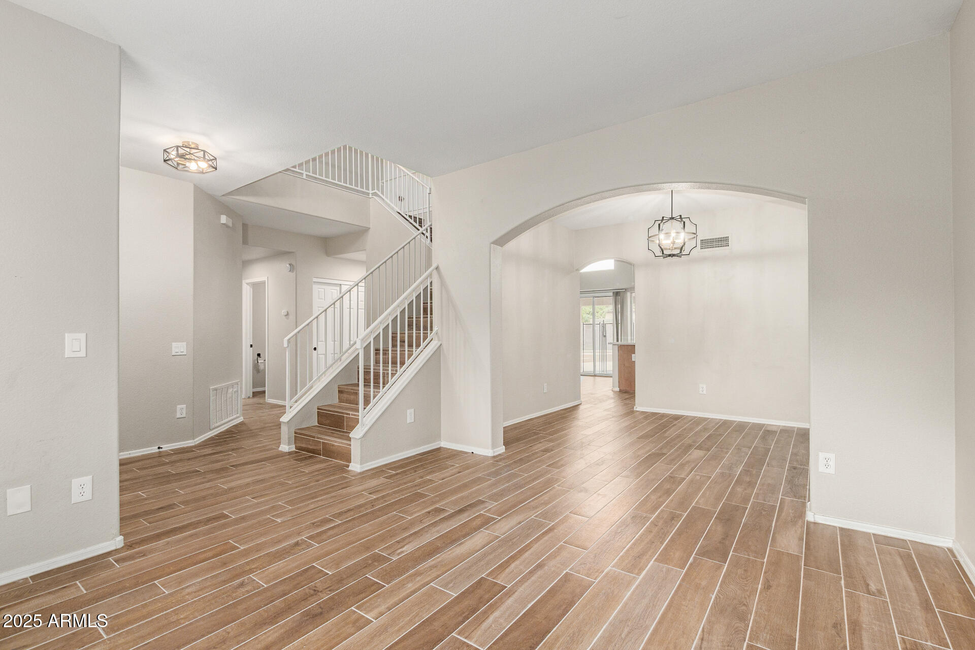4522 East Rowel Road Phoenix, AZ 85050 - Photo 7 of 49 a view of empty room with wooden floor