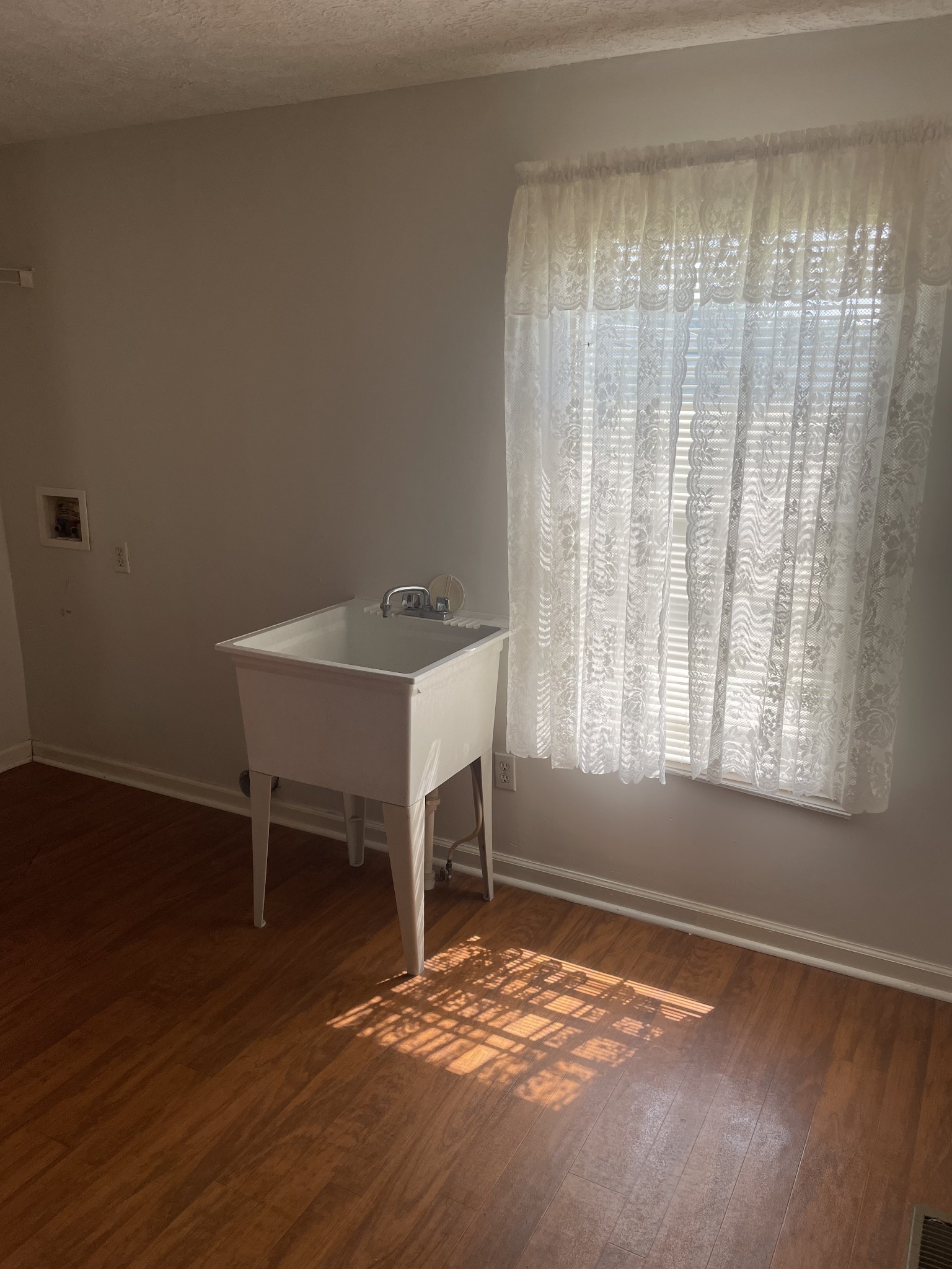 452 Chaffin Road Lafayette, TN 37083 - Photo 11 of 14 a view of a room with wooden floor and a window