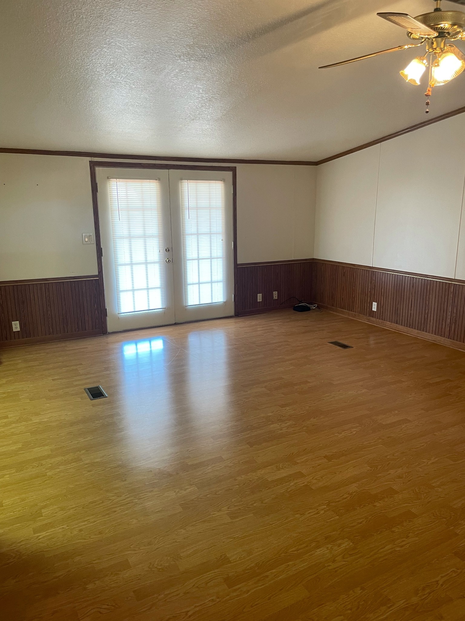 452 Chaffin Road Lafayette, TN 37083 - Photo 4 of 14 a view of an empty room with wooden floor and a window