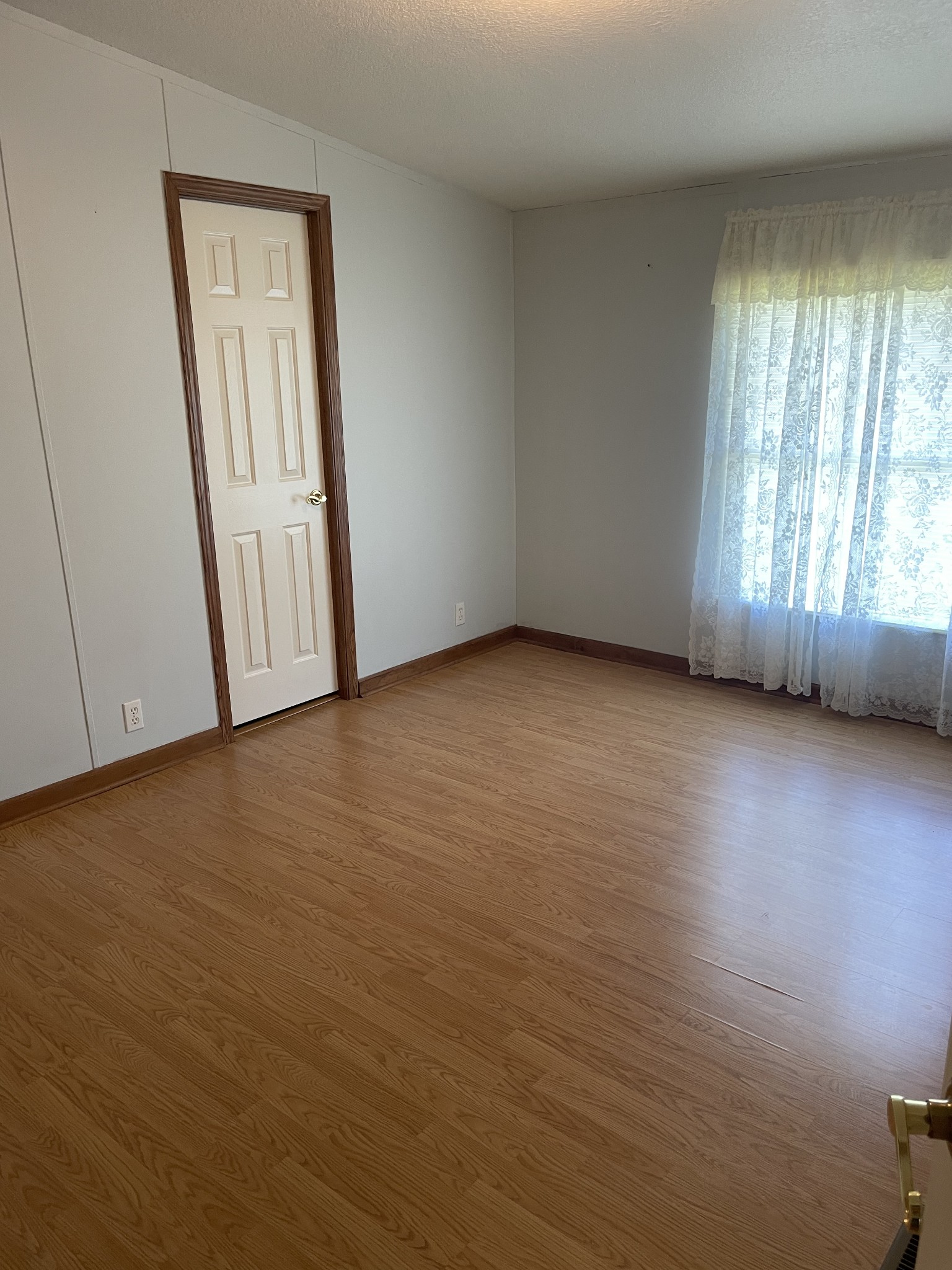 452 Chaffin Road Lafayette, TN 37083 - Photo 8 of 14 an empty room with wooden floor and windows