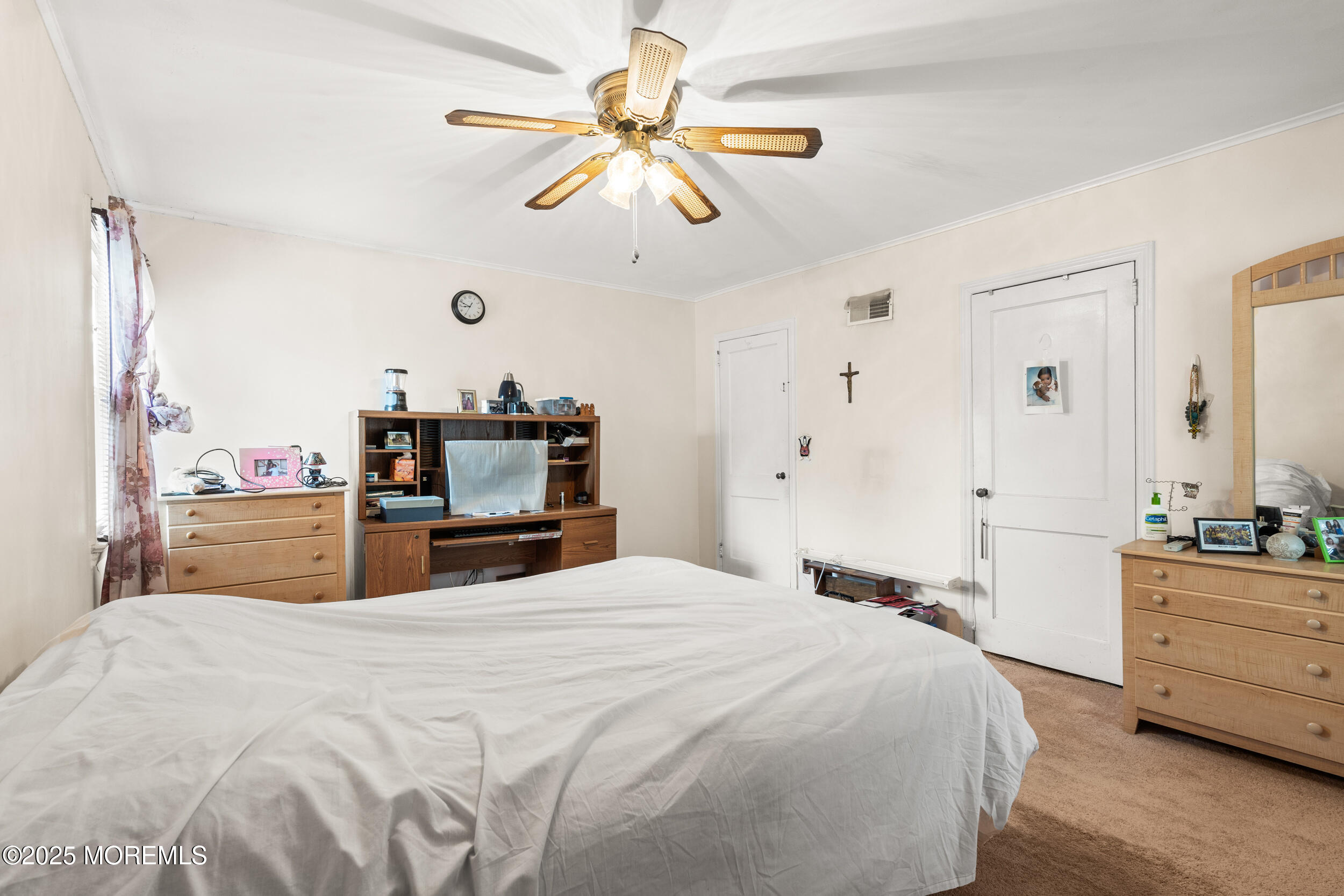 185 Pinecrest Road Oakhurst, NJ 07755 - Photo 12 of 23 a large bedroom with a bed and a chandelier