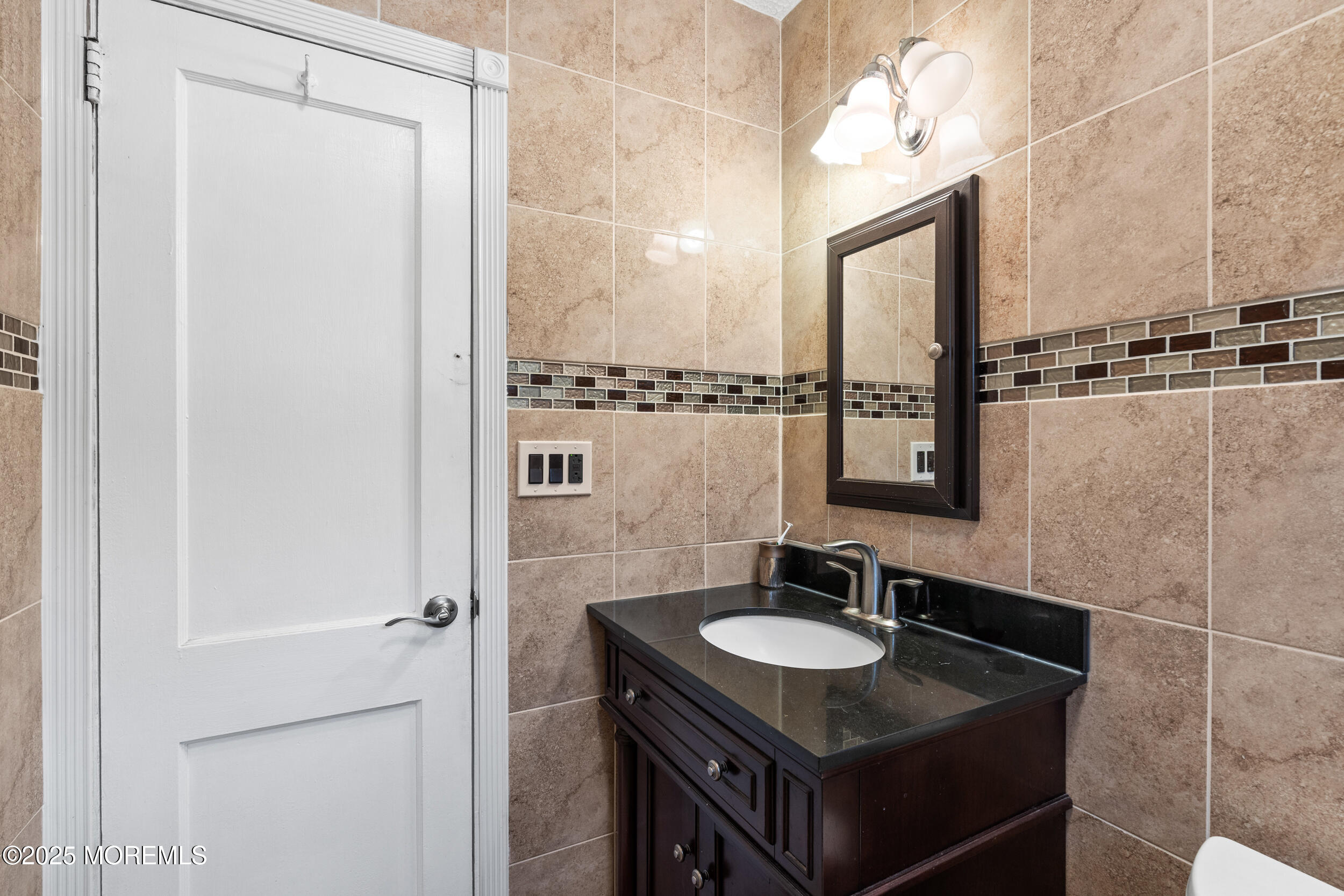 185 Pinecrest Road Oakhurst, NJ 07755 - Photo 14 of 23 a sink and a mirror