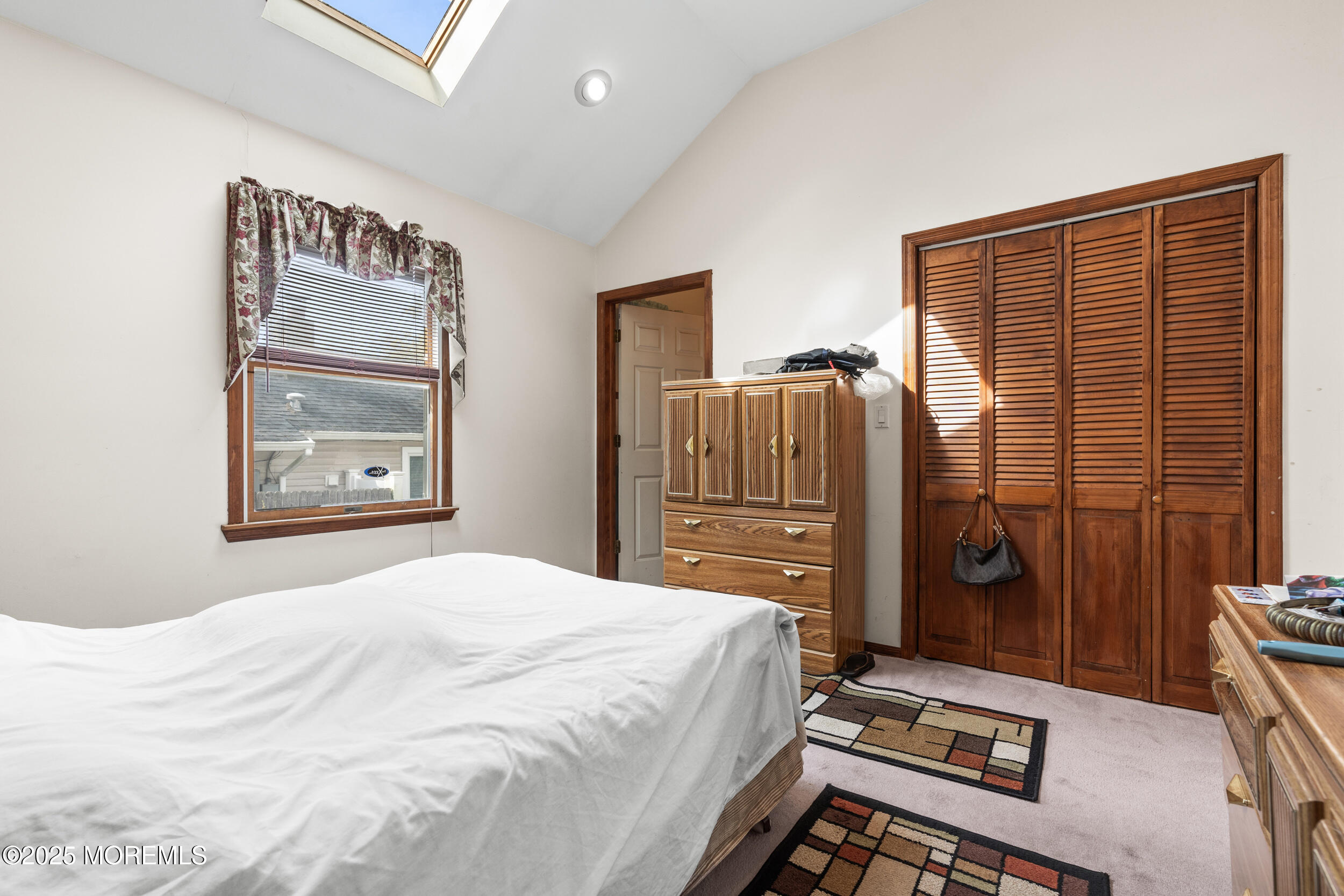 185 Pinecrest Road Oakhurst, NJ 07755 - Photo 18 of 23 a bedroom with a bed and wooden floor