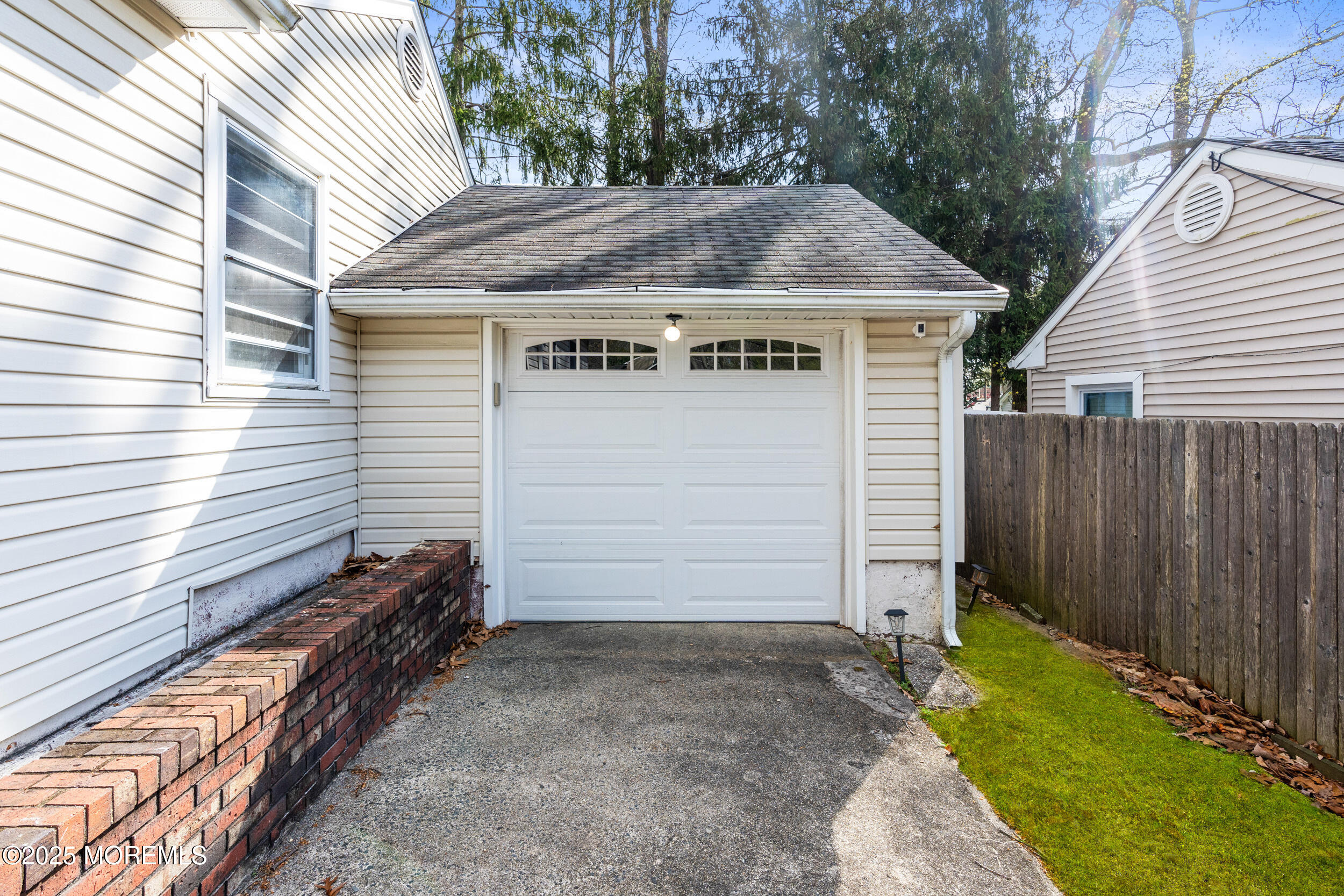 185 Pinecrest Road Oakhurst, NJ 07755 - Photo 21 of 23 a view of a small house in the backyard