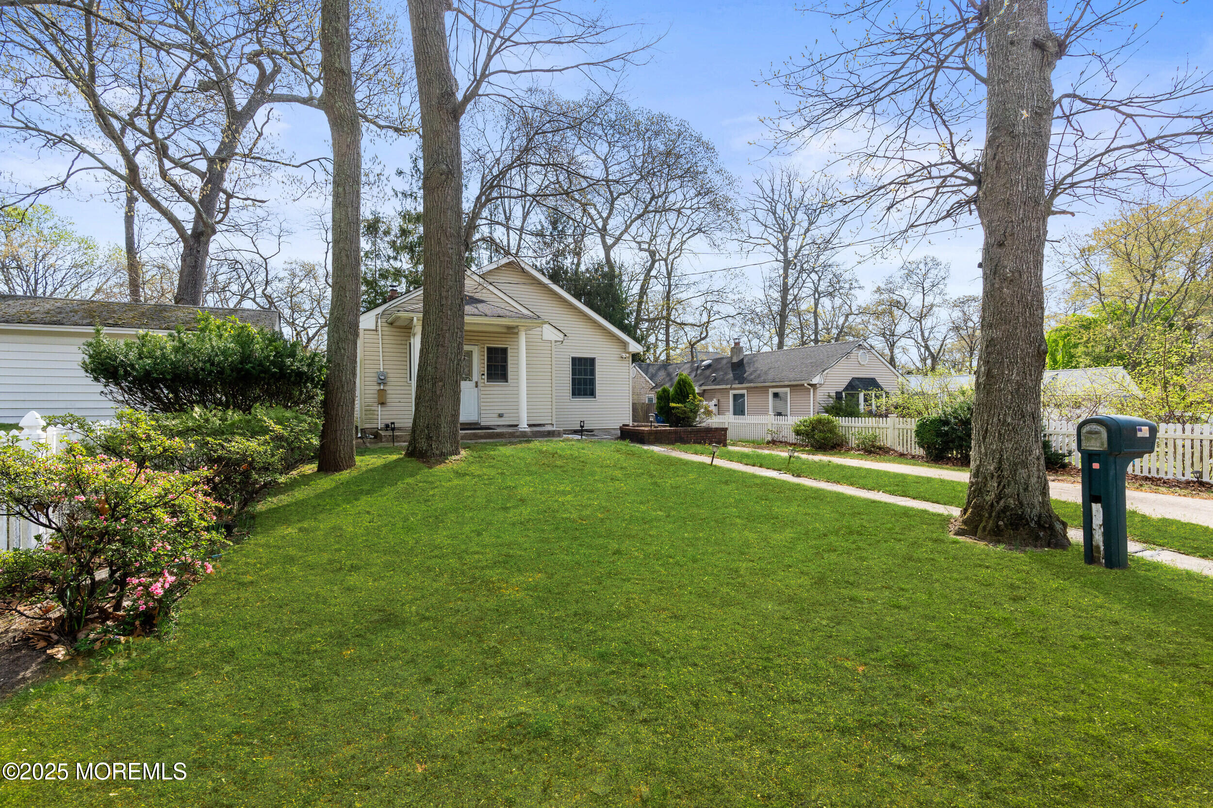 185 Pinecrest Road Oakhurst, NJ 07755 - Photo 22 of 23 a view of a house with backyard and sitting area