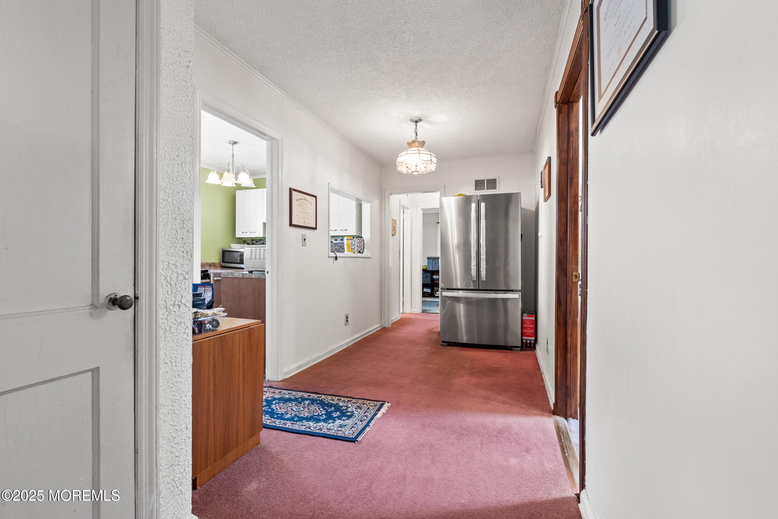 185 Pinecrest Road Oakhurst, NJ 07755 - Photo 9 of 23 a view of a kitchen with refrigerator and a stove