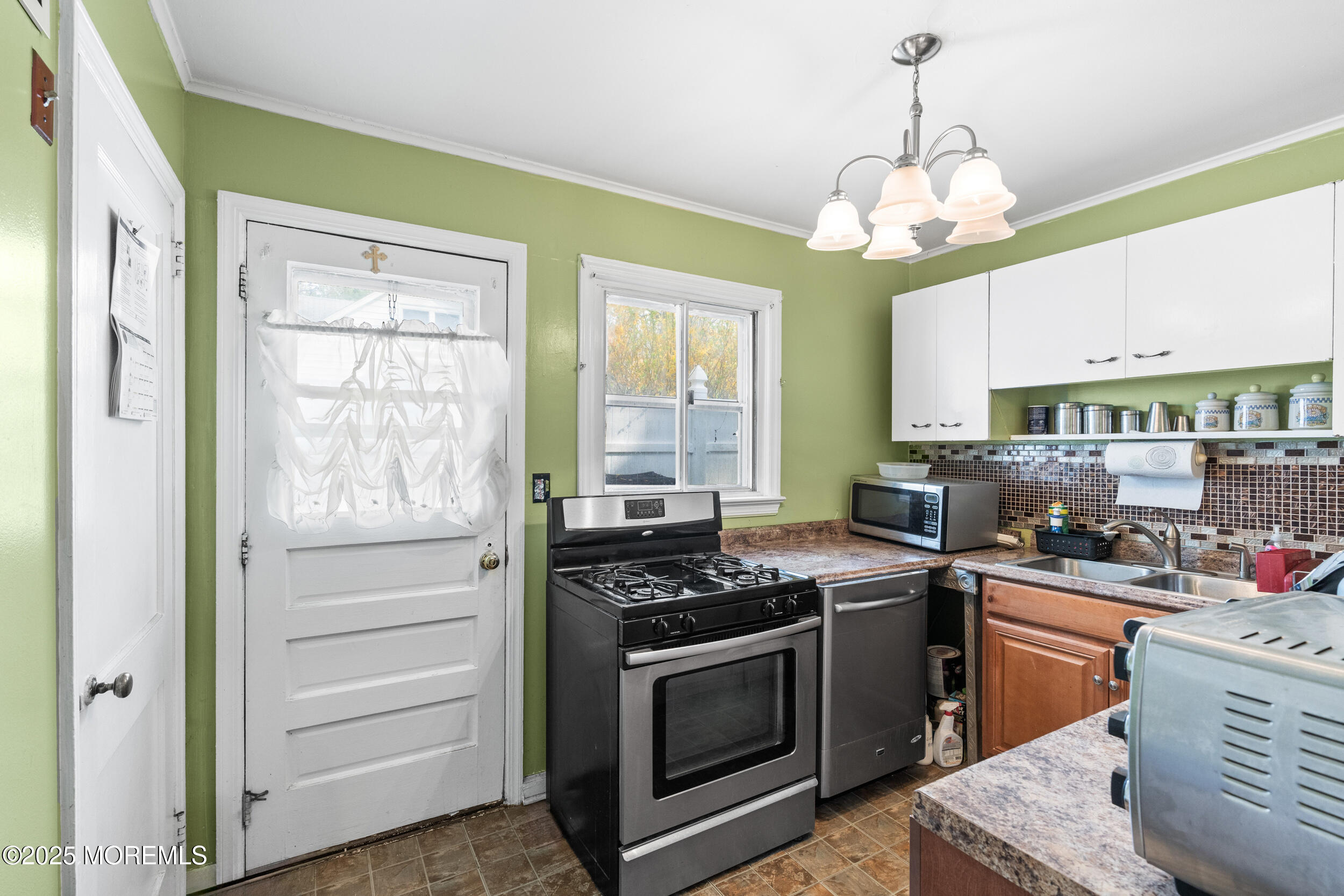 185 Pinecrest Road Oakhurst, NJ 07755 - Photo 10 of 23 a kitchen with stainless steel appliances granite countertop a stove and a sink