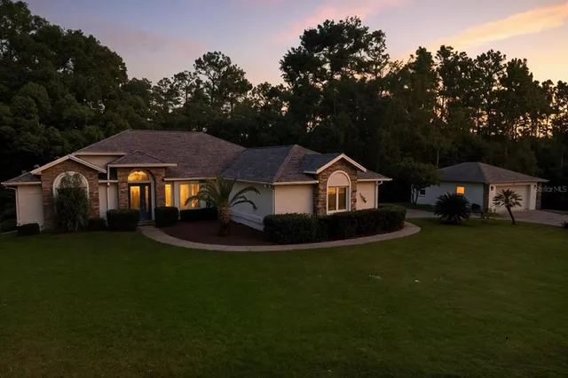 a front view of a house with a yard