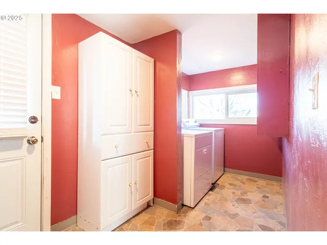 a kitchen with stainless steel appliances granite countertop a refrigerator and a stove