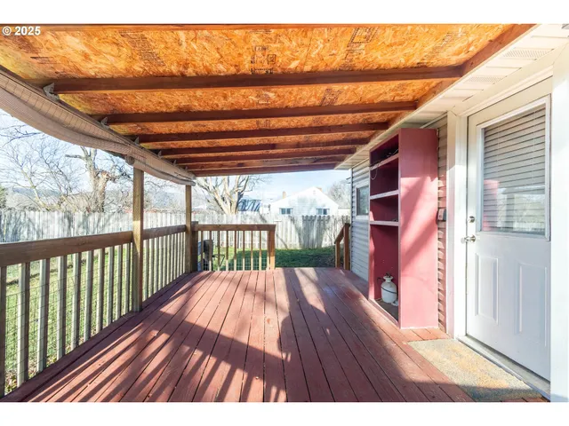 a view of a backyard with a small cabin