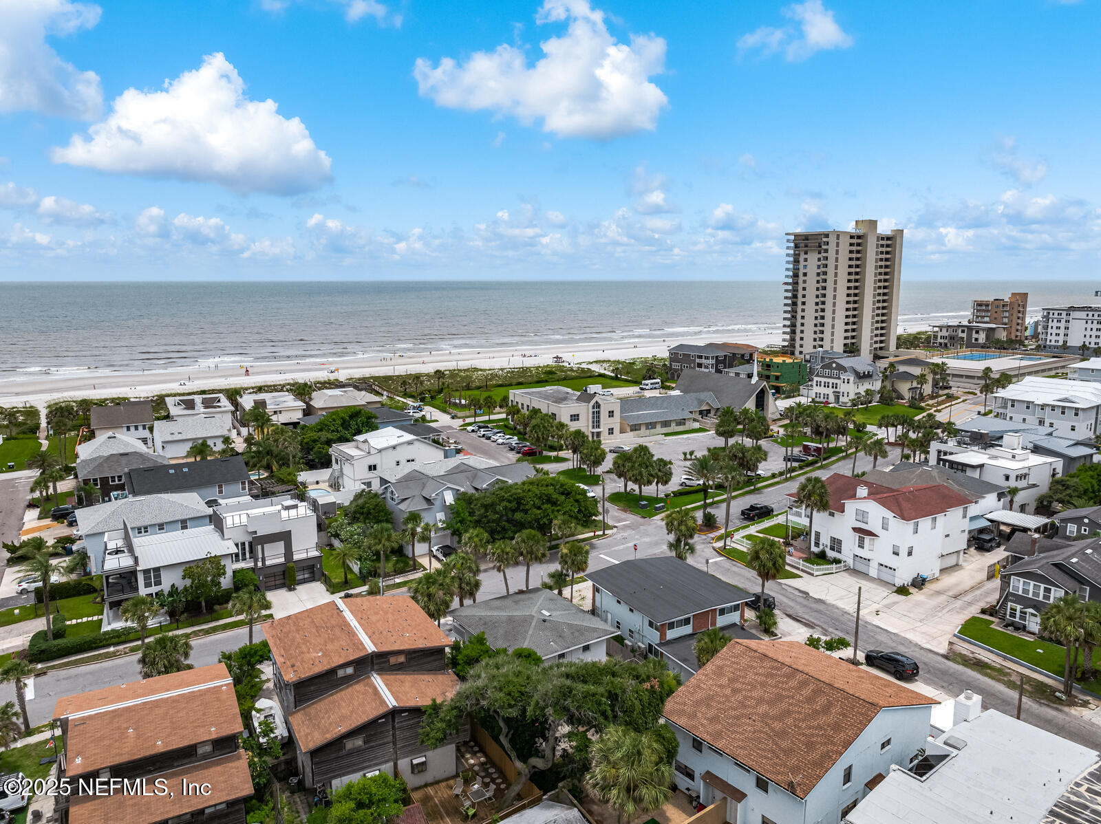 2016 First Street Neptune Beach, FL 32266 - Photo 10 of 17 an aerial view of a city with lots of residential buildings ocean and mountain view in back