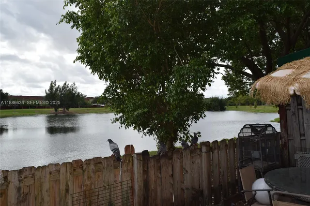 a view of lake with green space