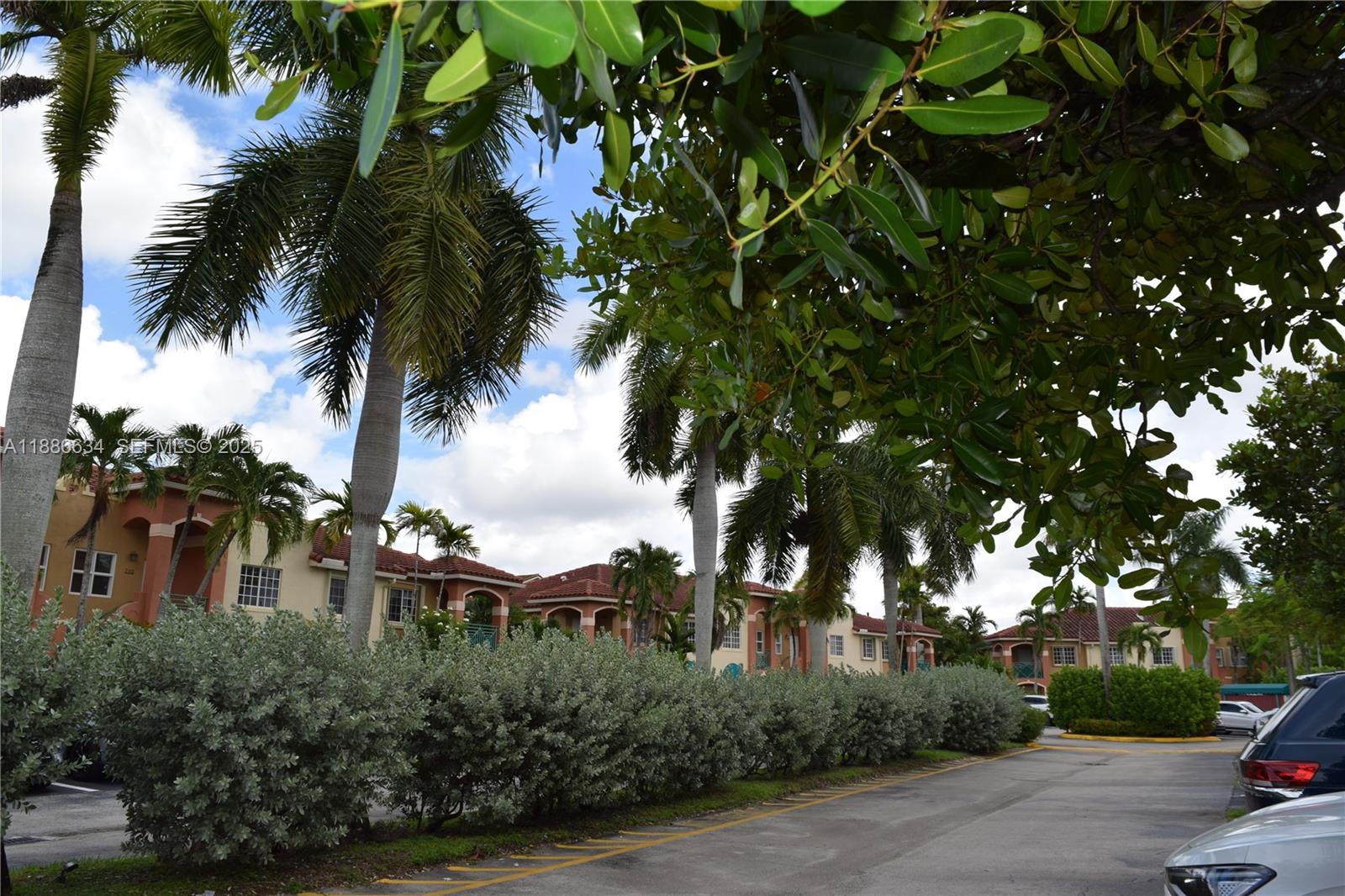 6970 Northwest 174th Terrace, Unit 404 Hialeah, FL 33015 - Photo 18 of 20 a view of a backyard of a house