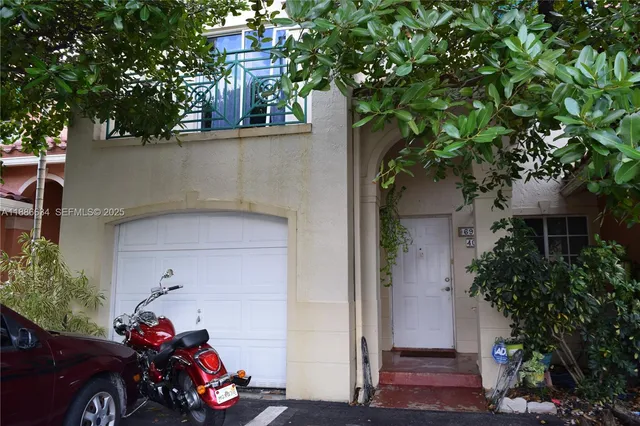 front view of a house with a car