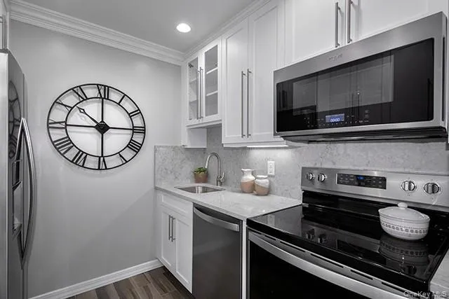 a kitchen with a stove and a microwave
