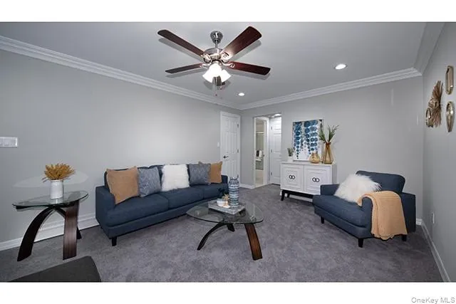 a living room with furniture and a lamp