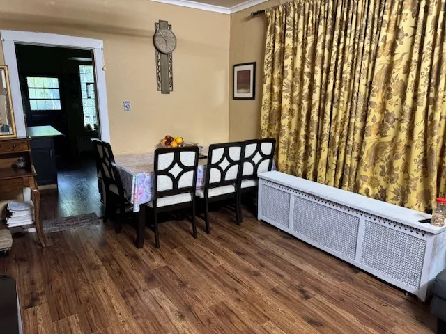 a view of a balcony with furniture and wooden floor