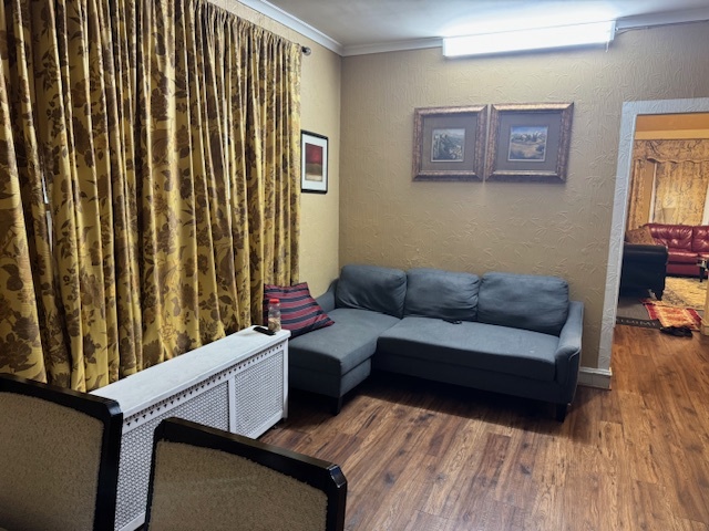 5829 North Washtenaw Avenue Chicago, IL 60659 - Photo 16 of 39 a living room with furniture and a wooden floor