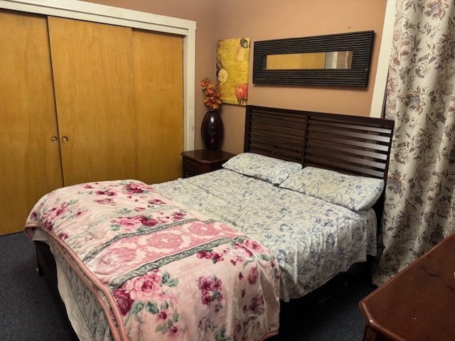 5829 North Washtenaw Avenue Chicago, IL 60659 - Photo 22 of 39 a bedroom with a bed and a flat tv screen on dresser