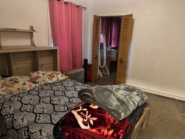 5829 North Washtenaw Avenue Chicago, IL 60659 - Photo 24 of 39 a bedroom with a bed and a fireplace