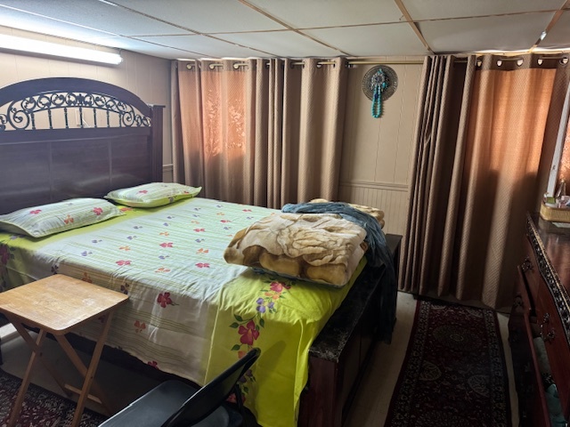 5829 North Washtenaw Avenue Chicago, IL 60659 - Photo 26 of 39 a bedroom with a bed and a table