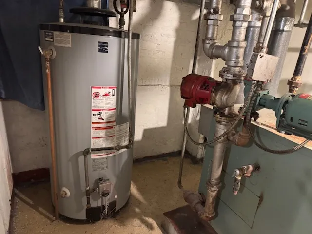 a view of a brick house with wooden floor and fence