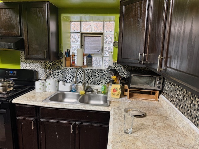 5829 North Washtenaw Avenue Chicago, IL 60659 - Photo 9 of 39 a bathroom with a sink and a mirror