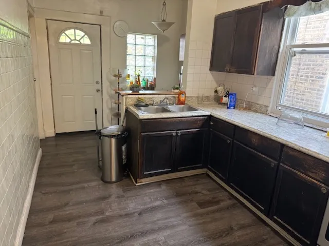 a kitchen with a sink and cabinets