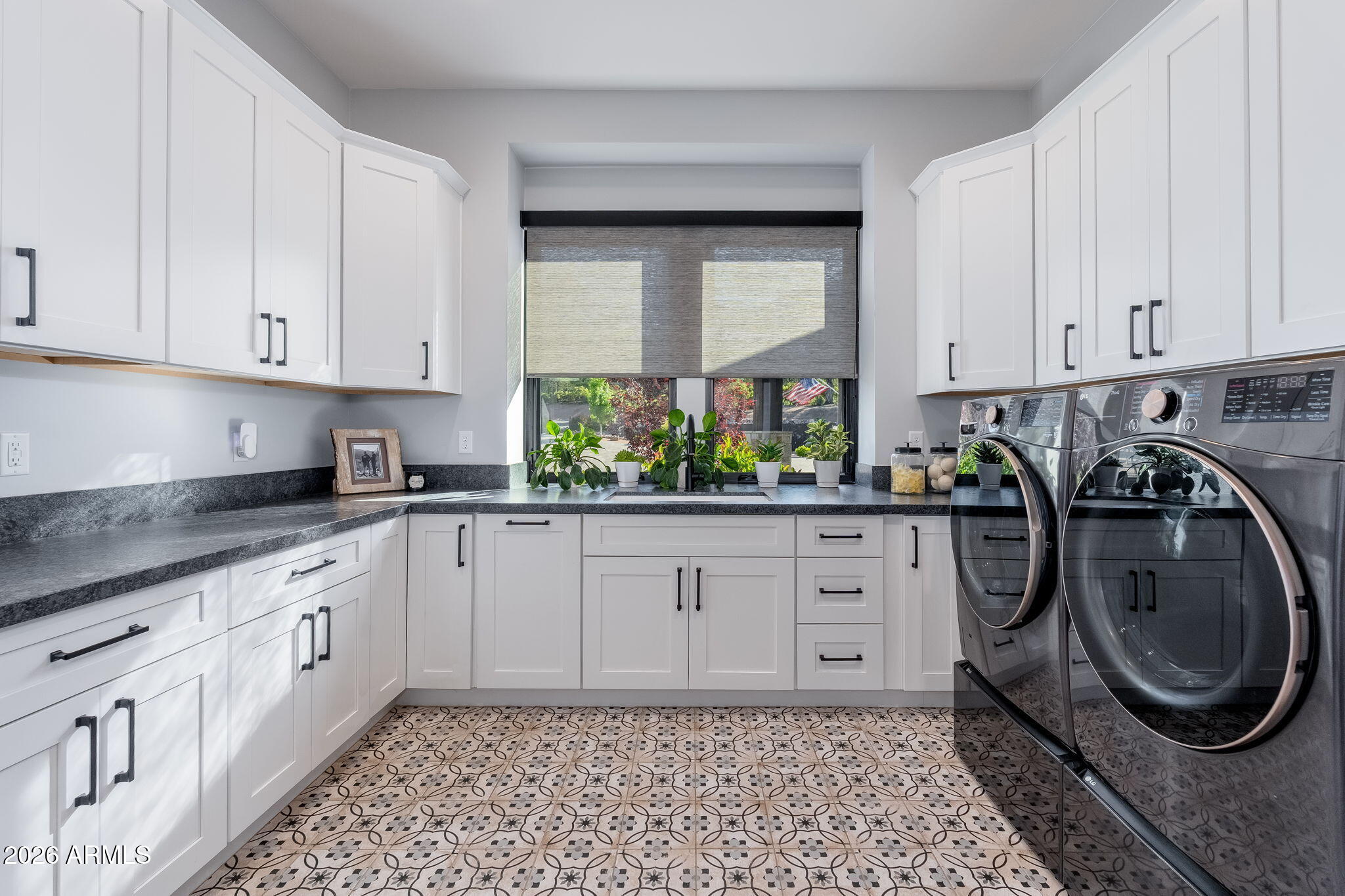 602 North Redbud Circle Payson, AZ 85541 - Photo 42 of 83 a kitchen with white cabinets a sink a washer and dryer