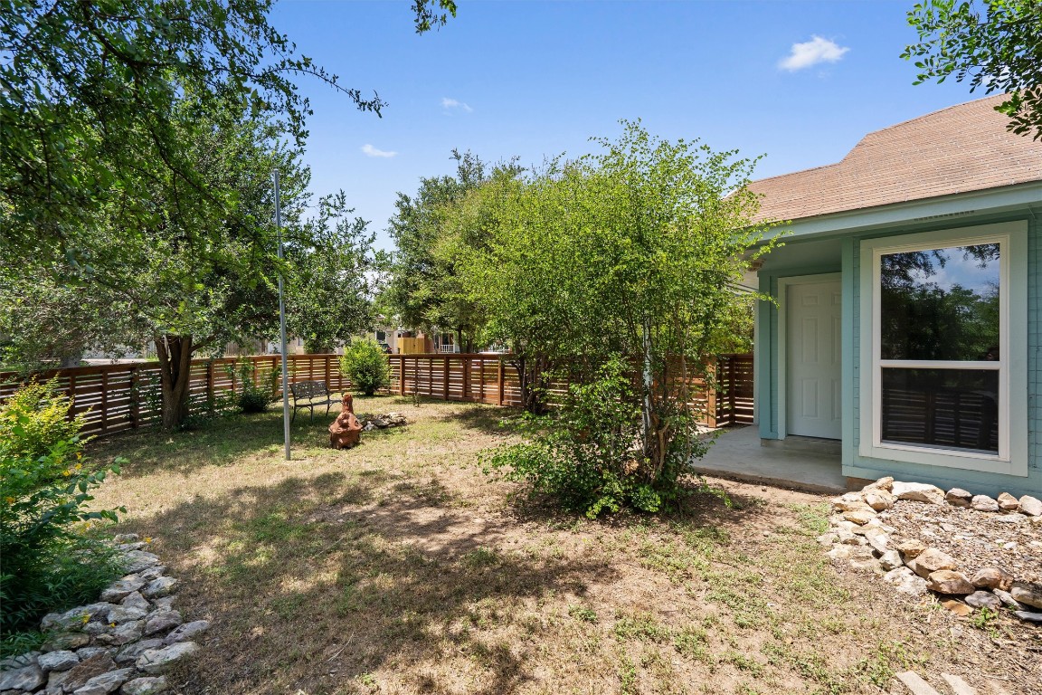 8615 Croydon Loop Austin, TX 78748 - Photo 24 of 28 a view of a bench in the backyard of a house