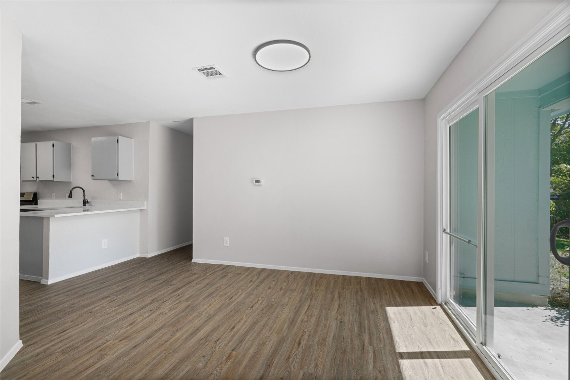 8615 Croydon Loop Austin, TX 78748 - Photo 7 of 28 a view of a room with wooden floor and white wall