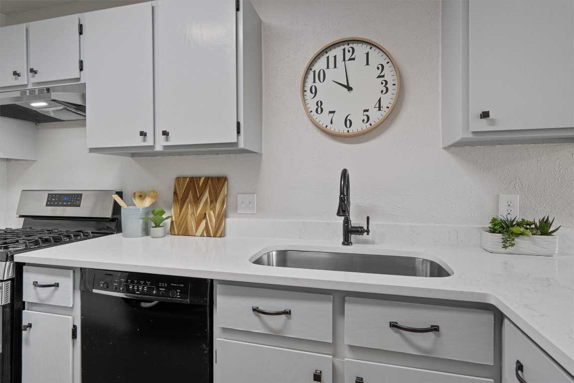 8615 Croydon Loop Austin, TX 78748 - Photo 10 of 28 a view with a sink and a stove top oven