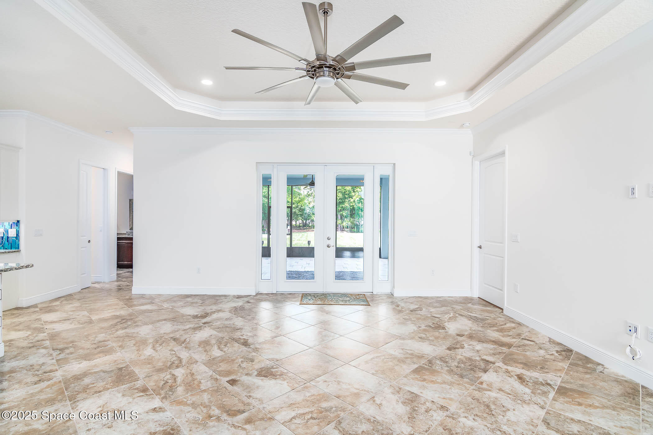 287 Baker Road Melbourne, FL 32934 - Photo 53 of 76 Double Doors to screened patio