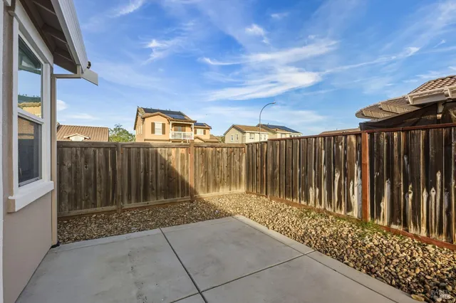 a view of a wooden fence next to a house