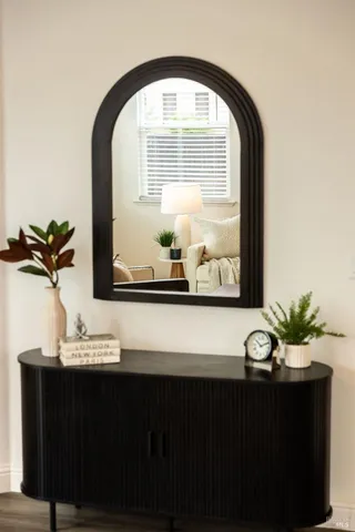 a view of a dining room with a table and chairs