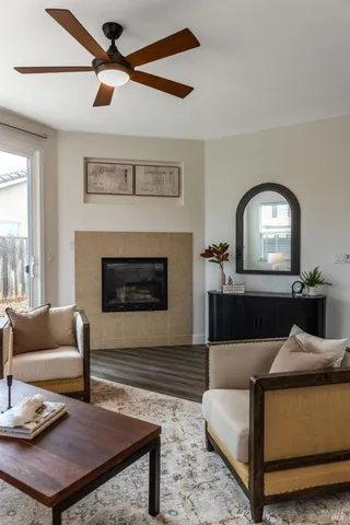 a living room with furniture and a fireplace