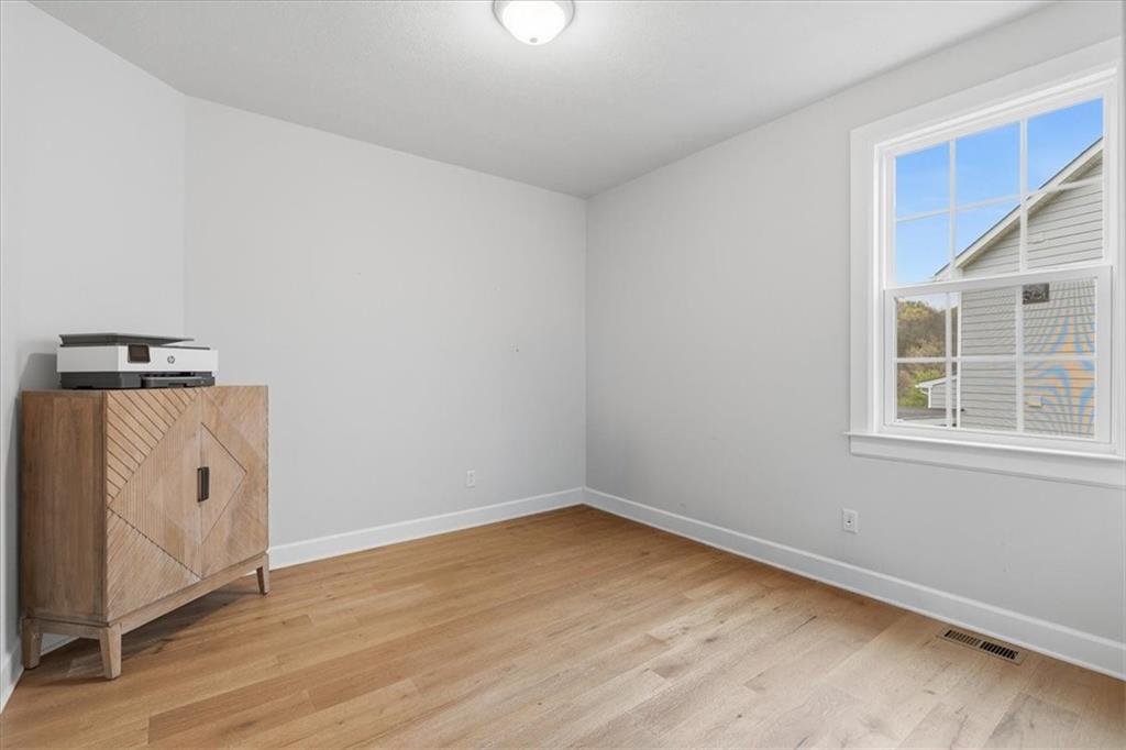 333 Crest Lane Mars, PA 16046 - Photo 25 of 32 an empty room with wooden floor and windows