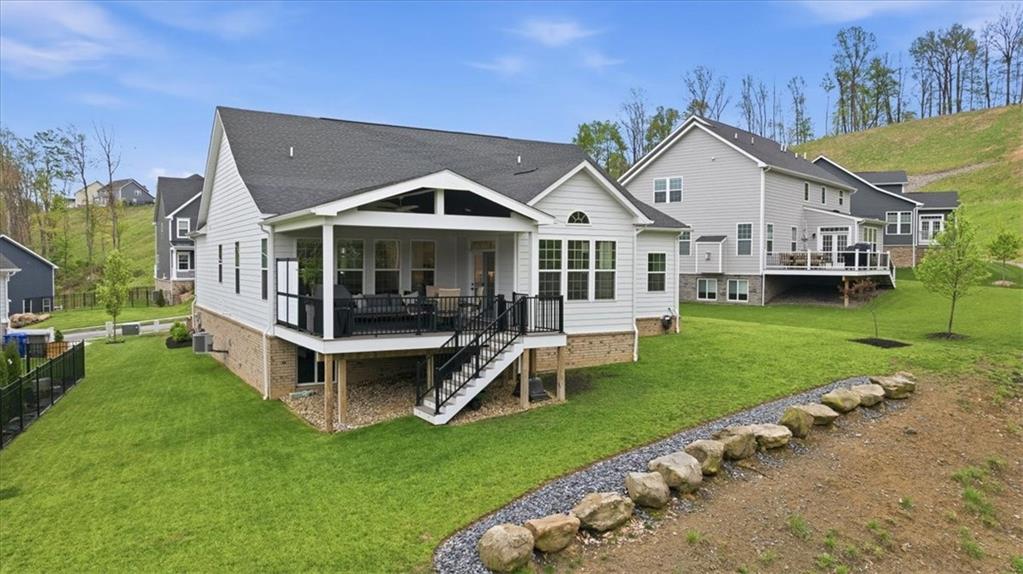 333 Crest Lane Mars, PA 16046 - Photo 29 of 32 a front view of a house with a yard table and chairs