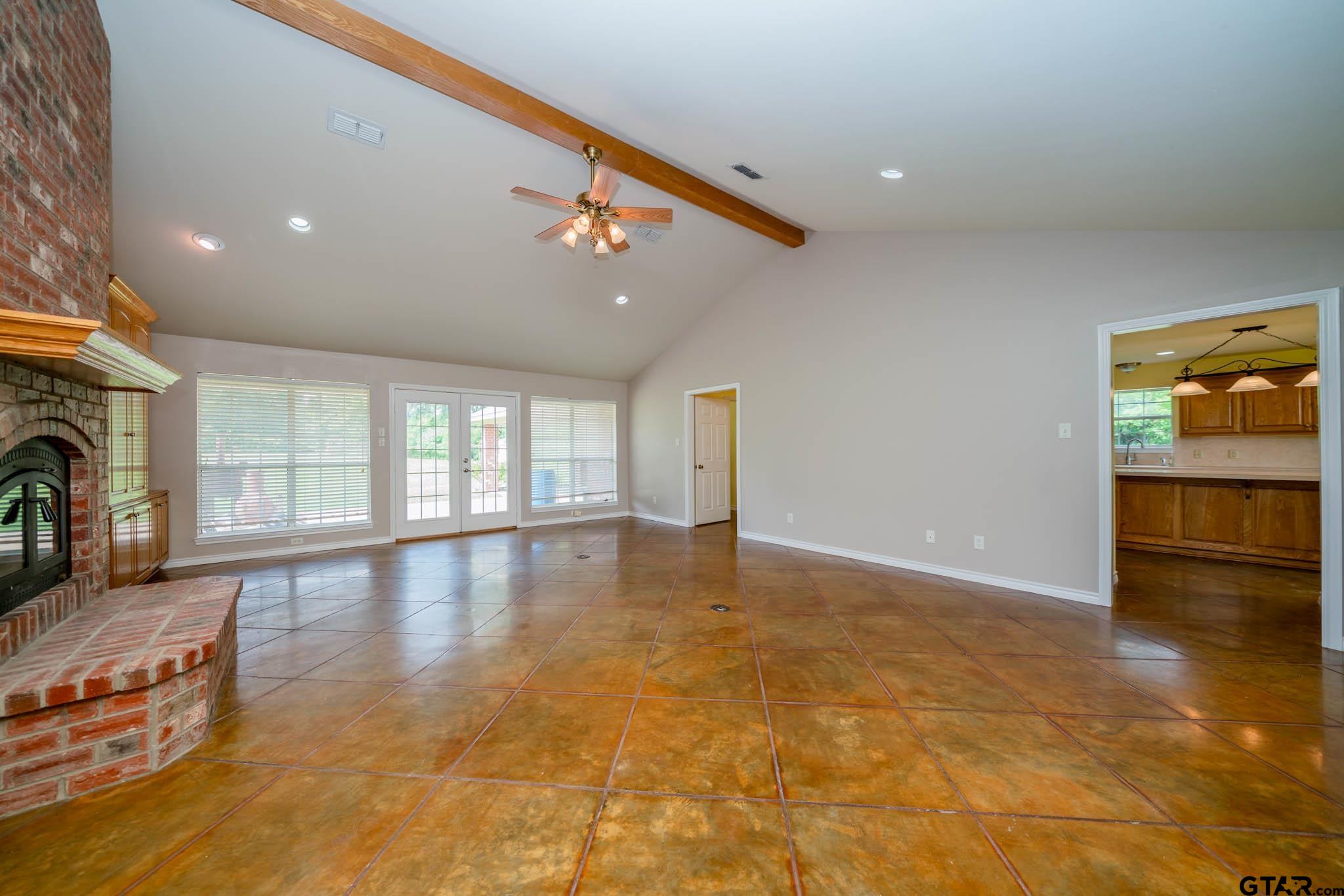 3460 Hawk Road Diana, TX 75640 - Photo 15 of 40 a view of empty room with wooden floor and fireplace