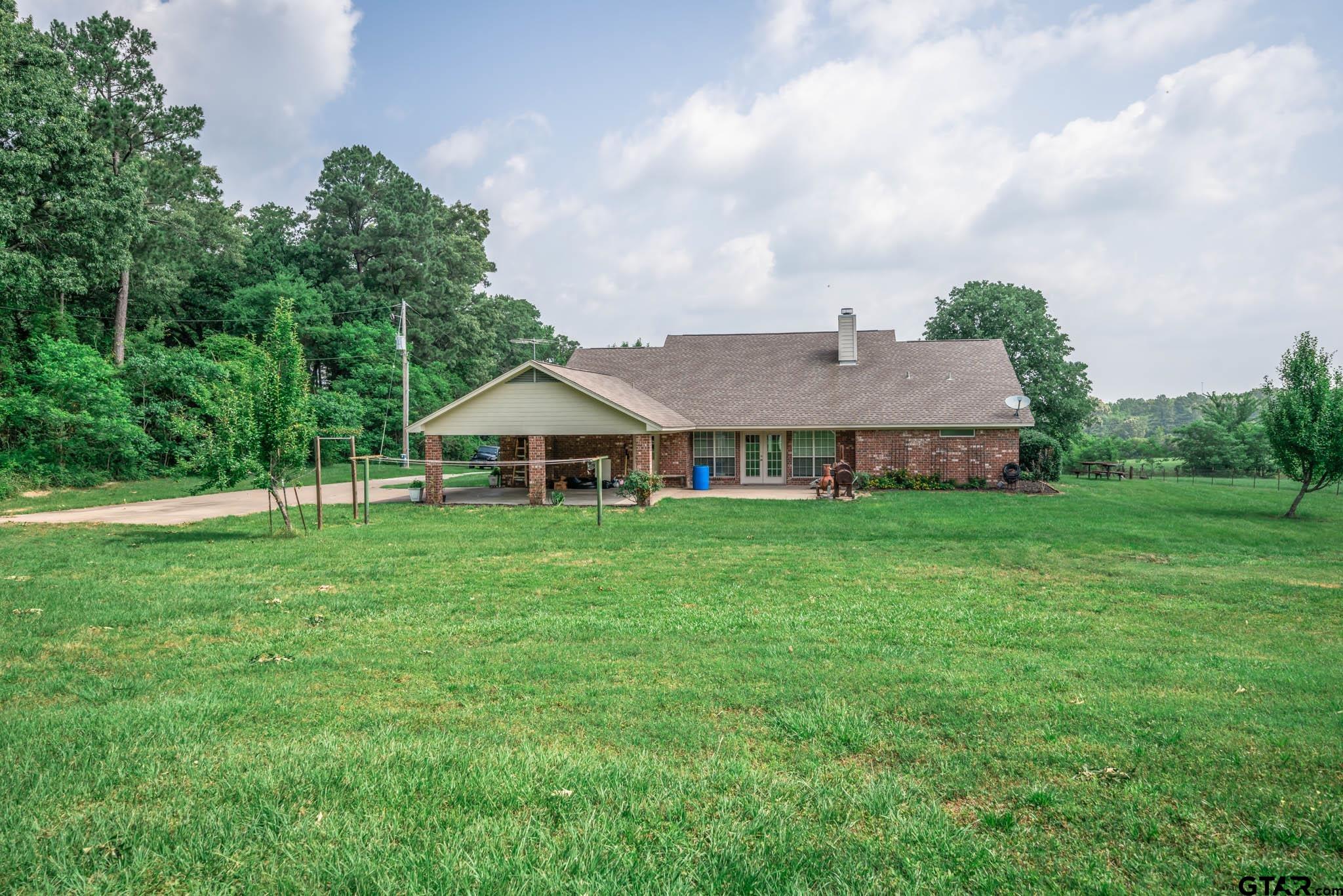 3460 Hawk Road Diana, TX 75640 - Photo 31 of 40 a front view of a house with garden