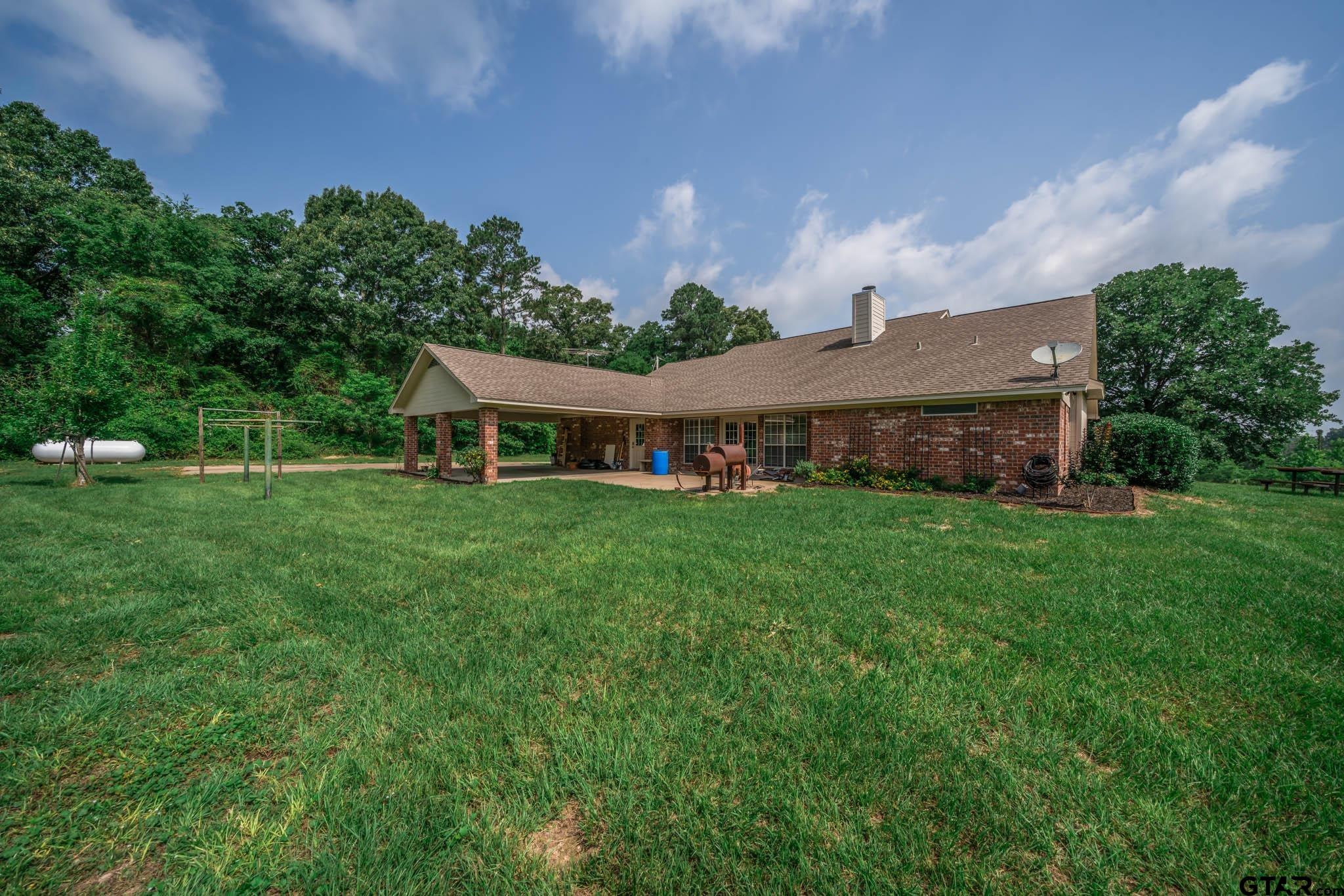 3460 Hawk Road Diana, TX 75640 - Photo 32 of 40 a front view of a house with garden