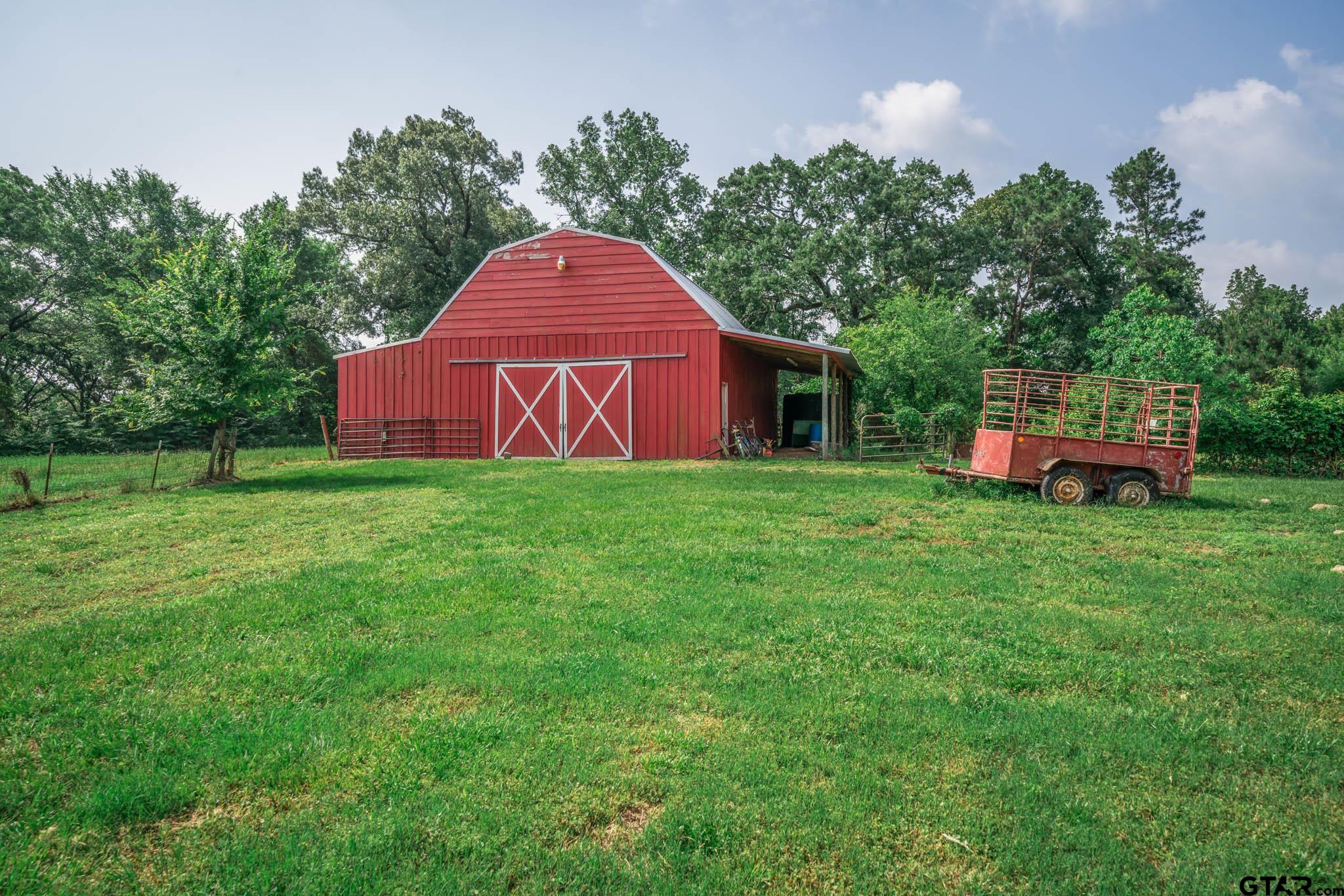 3460 Hawk Road Diana, TX 75640 - Photo 34 of 40 a view of a house with a yard