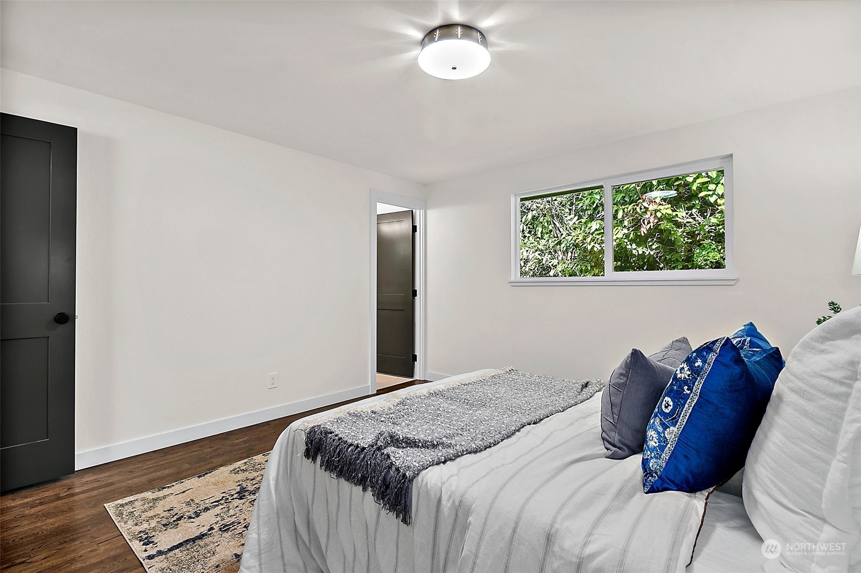 15846 Southeast 132nd Place Renton, WA 98059 - Photo 29 of 37 a bedroom with bed and a window