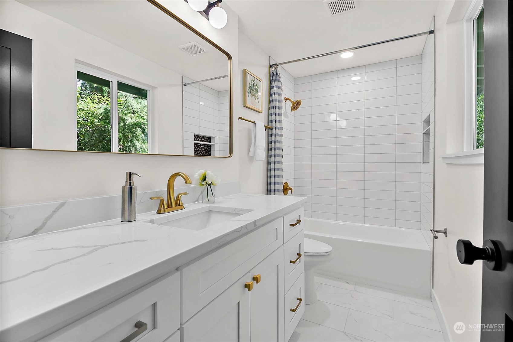 15846 Southeast 132nd Place Renton, WA 98059 - Photo 31 of 37 a bathroom with a granite countertop sink a mirror a shower and a bathtub