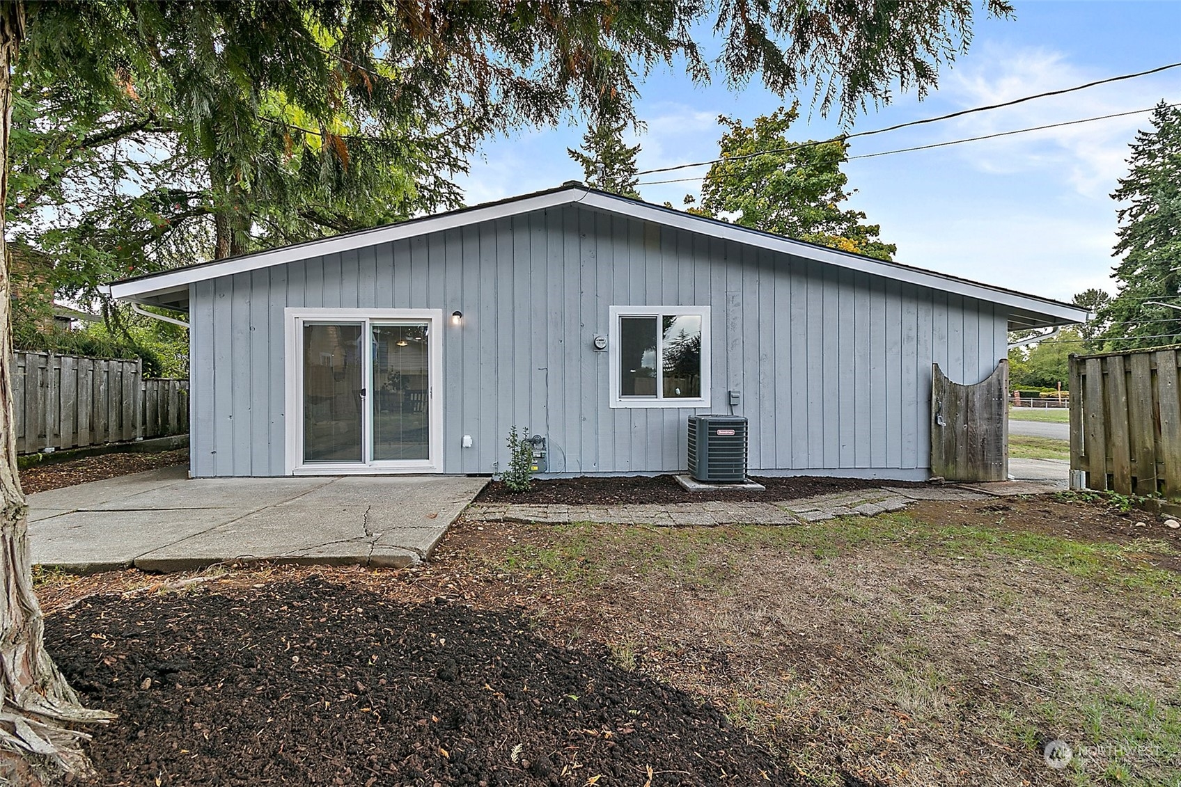 15846 Southeast 132nd Place Renton, WA 98059 - Photo 6 of 37 a view of a house with a yard and garage