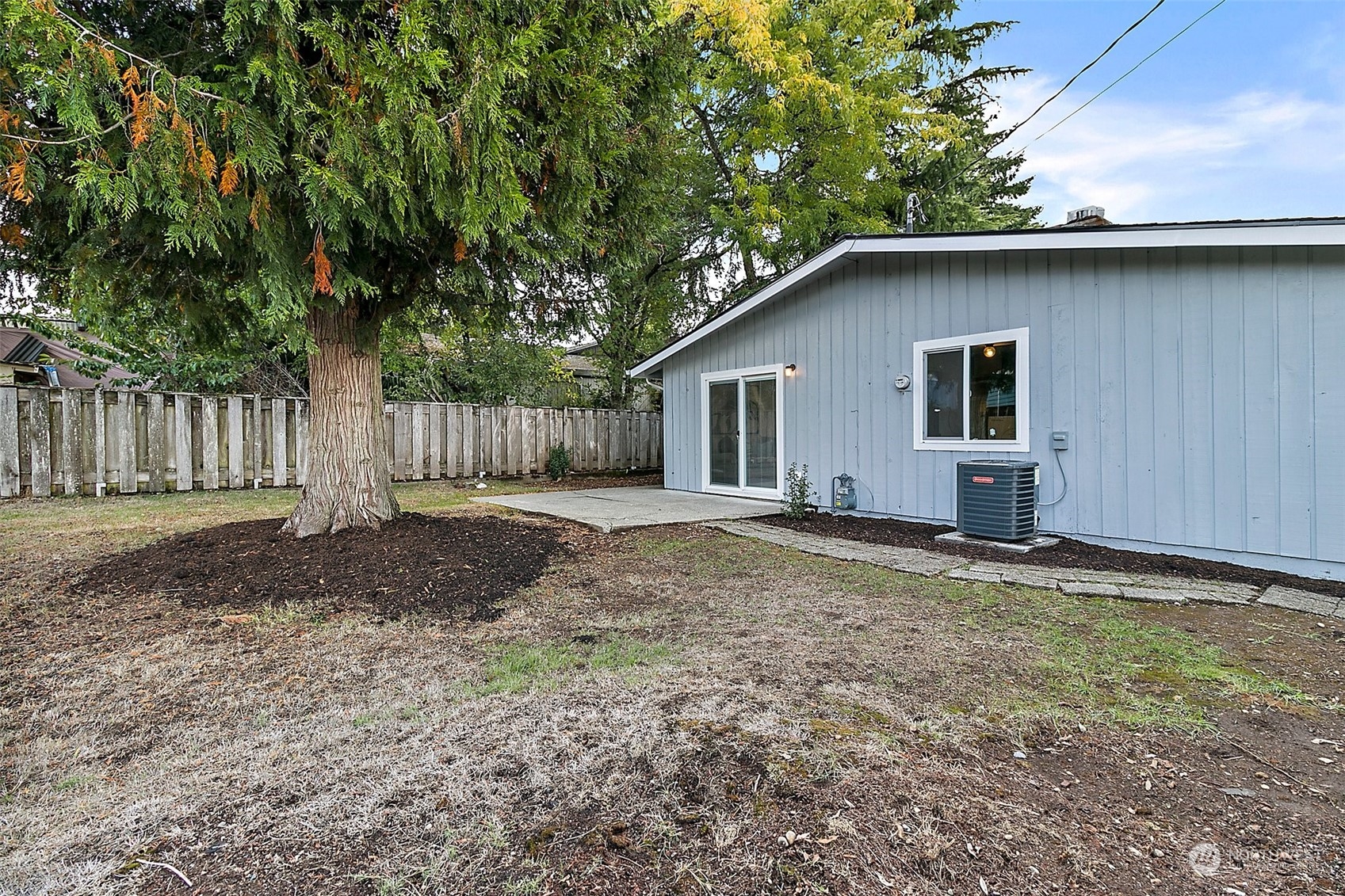 15846 Southeast 132nd Place Renton, WA 98059 - Photo 7 of 37 a house with trees in the background