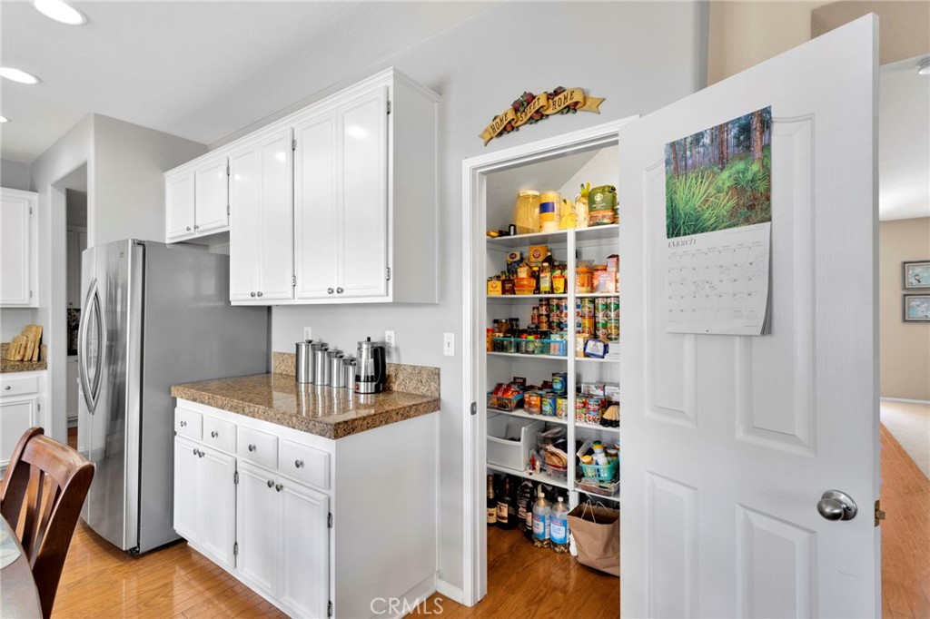 13798 Misty Path Victorville, CA 92392 - Photo 13 of 55 a kitchen with stainless steel appliances granite countertop a refrigerator and a sink