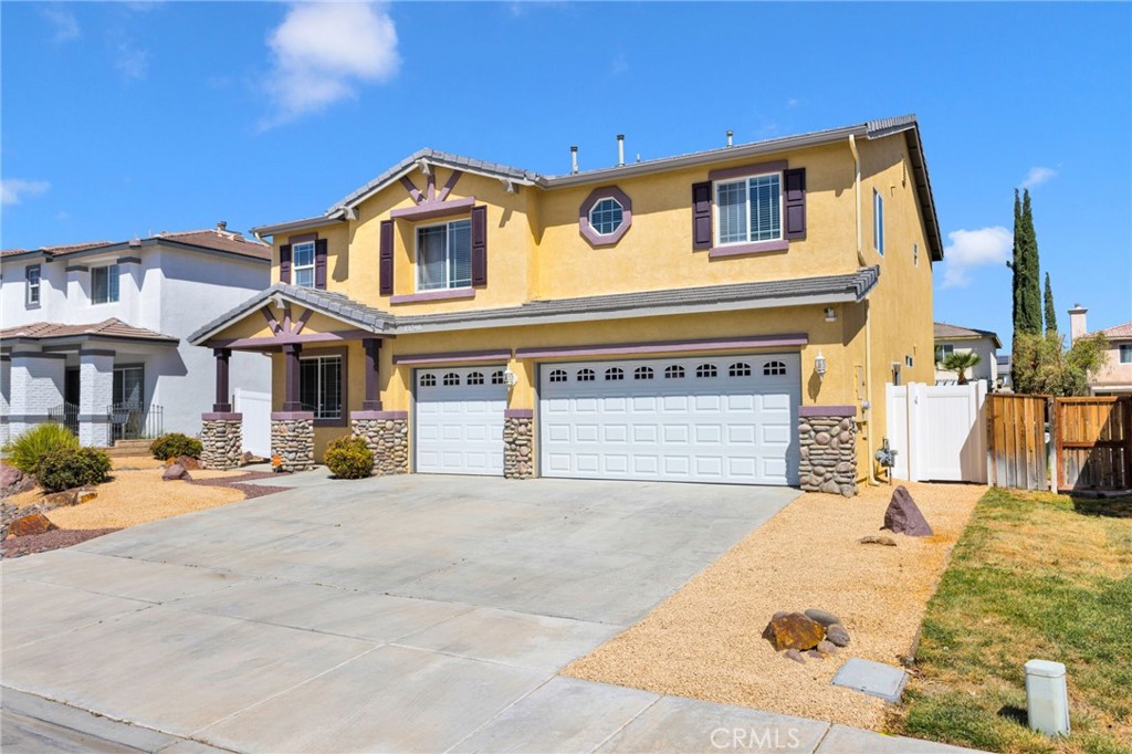 13798 Misty Path Victorville, CA 92392 - Photo 2 of 55 a front view of a house with a yard