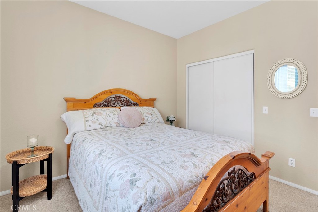 13798 Misty Path Victorville, CA 92392 - Photo 21 of 55 a bedroom with a bed and a lamp