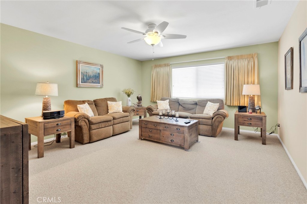 13798 Misty Path Victorville, CA 92392 - Photo 26 of 55 a living room with furniture and a large window